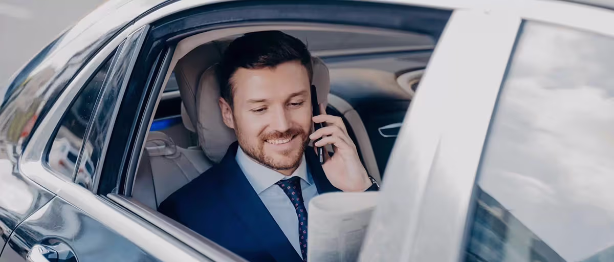 corporate client in the limo talking on the phone